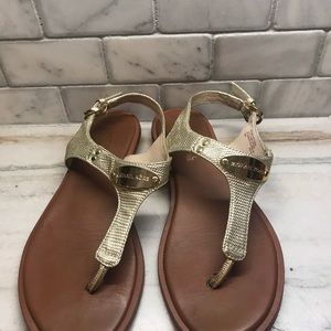 Gold sandals by Michael Kors